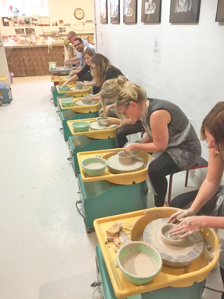 Group pottery class in session