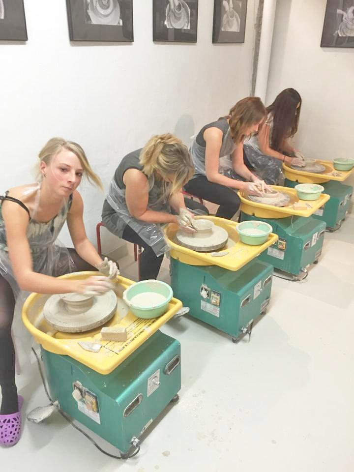 Pottery class participants working